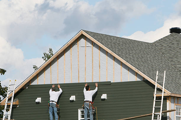 Professional Siding technician working in Hydes, MD
